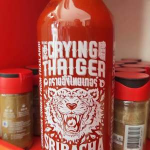 Crying Thaiger Sriracha Hot Chili Sauce From Thailand 740ml - Red sauce with green cap - Spicy condiment - Tiger logo - Chili peppers - Dip for spring rolls.