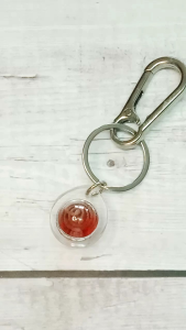 พวงกุญแจลูกแก้วแดงยันต์นะวัดถ้ำเมืองนะ