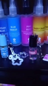 Mini anney perfume 5 ml with keychain lucky charm. Pink floral design. Keychain includes flower and charm.