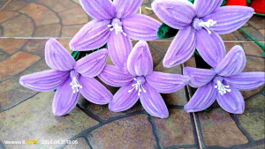 lily flower per stem with leaves made of fuzzy wire pipe cleaners handmade with love handcrafts. And perfect for making a bouquet. Per piece only.