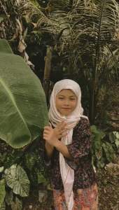 Traditional Batik Pattern Kids Dress Set Baju Opah for Girls with Hijab and Long Skirt Natural Outdoor Setting. Set Baju Opah Kain Batik