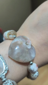 LITTLE D SAKURA FLOWER AGATE NATURAL CRYSTAL BRACELET with heart-shaped centerpiece and silver accents.