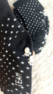 Kids Anti-Slip Socks – Mall Pull Out (Black Grip Socks) with white star pattern and paw grip soles.