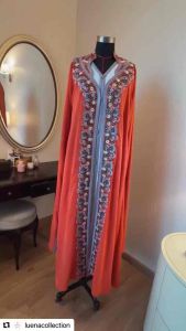 A rich amber-orange shade Abaya
