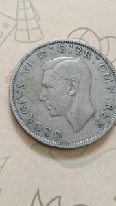 100% Authentic 1948 GREAT BRITAIN KING GEORGE VI TWO SHILLINGS COPPER-NICKEL COIN catalogue #0232 Country United Kingdom Period: King George VI 1937 - 1952 Ruler: George VI Coin type: Circulation coins Denomination: 2 shillings (florin)