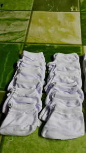 bottles mittens and gloves plain white and colored for newly born babies cotton