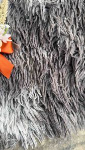 Chest corsage with orange/blue center trigo