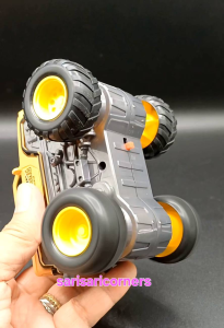 Yellow RC off-road monster truck with large wheels and rugged design. Rotate 360° feature. Wild Power branding. Suitable for outdoor play.