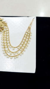 Indian Hair Accessory Jada Billai with gold chains and pearl embellishments