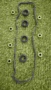 Valve Cover Gasket Honda City SEL VTEC Jazz SAA VTEC - Black rubber gasket with multiple circular seals and washers.