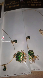 Indian Invisible Chain Gold necklace with pink lotus pendant and matching charms.