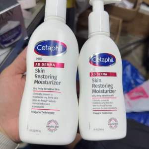 Cetaphil Pro Derma Skin Restoring Moisturizer 295ml / 145ml. White pump bottles. Beauty personal care bath body body moisturizers.