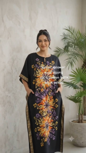 KAFTAN KELAWAR TUGU AGUNG Womens Dresses with Floral Patterns and Cultural Designs. Black and red dresses with intricate floral and cultural designs. Suitable for cultural events and casual wear.