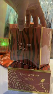 Tiger Aroma Coffee Original Instant Drink Kopi 1 box 10 sheets. Red tiger-striped packaging with coffee beans and cup.