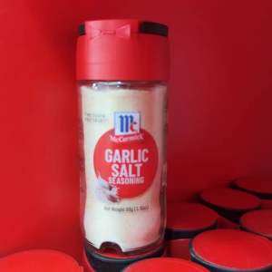 McCormick Garlic Salt Seasoning 88g - Red container - Food staple for cooking and baking.