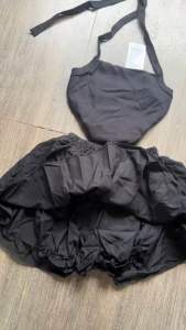 Set Bộ Búp Be Rỳ  Xám Áo Thun Đính Nơ + Chân Váy Bản To Xếp Ly Xoè Có Lót Quần