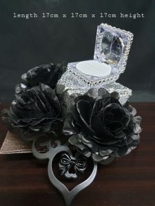 bekas cincin#23 is a flowery bekas holding a ring box in weddings