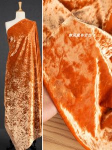 ผ้ากำมะหยี่ทองแดงสีส้ม ผ้ากำมะหยี่มียางยืดคุณภาพสูงสำหรับเสื้อผ้าชุดกี่เพ้าสไตล์จีน ผ้ากำมะหยี่มีลายดอกไม้สีทอง