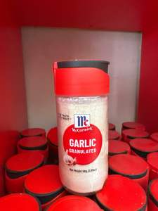 McCormick Garlic Granulated 58g bottle - red cap - white granules - kitchen spice