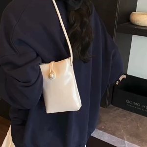 SEA YADOU  กระเป๋าถือทรงบัคเก็ตแบบเรียบหรูสำหรับผู้หญิง ด้วยหัวเข็มขัดไข่มุก สไตล์แฟชั่นและหลากหลายการใช้งาน