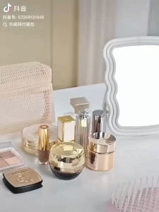 OKEY SHOP Mesh Cosmetic Bag Set with Transparent Mesh Design for Makeup Storage and Organization on a White Desk with Artwork and Accessories