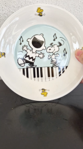 2016 Peanuts Worldwide LLC ceramic coaster (Charlie is singing & Snoopy is dancing)