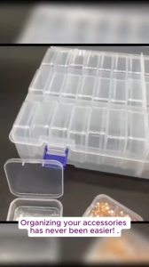 Transparent plastic storage box with multiple compartments and lids for organizing small items.