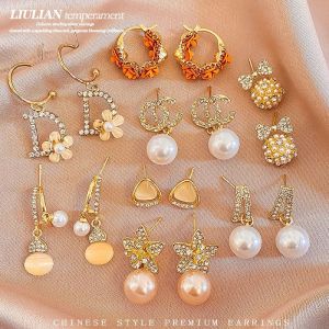 Korean light luxury pearl earrings 2025 new womens gold diamond earrings outdoor travel fashion earrings