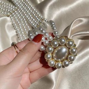 Panda SJK เข็มขัดมุกผู้หญิงสายรัดข้อมือยืดหยุ่นสีขาวเกาหลีเข้ากับทุกชุดสุภาพสตรีกระโปรงเครื่องประดับแฟชั่นหัวเข็มขัดโลหะเสื้อผ้า2023นิ้วเข็มขัดสายรัดสุดหรู