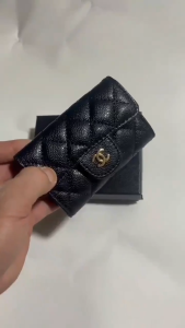 Card holder wallet with snap closures and metallic charm -woman