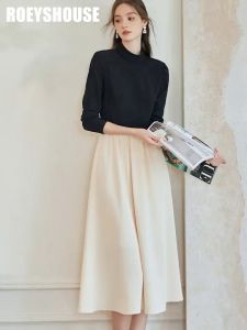 Đầm liền đen phối trắng tay dài dáng xoè