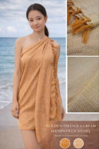 Golden-orange and cream handwoven shawl with textured fabric and fringed edges. Suitable for beach or casual wear.