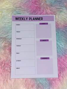 Weekly Planner with green yellow blue purple and pink sections for organizing tasks and schedules.
