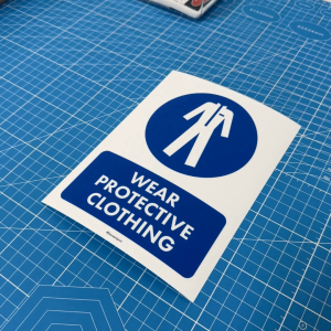 Wear Protective Clothing. Pakai Pakaian Perlindungan. Sticker Safety Compliance Sign. Baju Protection Required PPE Label