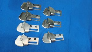 LAP SEAM FOLDER FOR DOUBLE NEEDLE CHAINSTITCH SEWING MACHINE