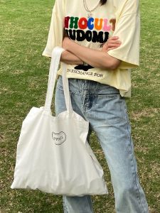 White Minimalist Atmosphere Canvas Bag: Large Capacity Commuter Single Shoulder Bag for Women