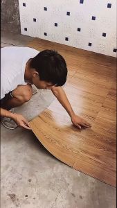 3D Wood Grain Floor Sticker PVC Vinyl Tile Flooring Self Adhesive Waterproof Venile Tiles Home Decor\\n\\n What Are 3D Wood Grain Floor Stickers & PVC Vinyl Tiles?\\n\\n3D wood grain floor stickers and PVC vinyl tiles are innovative flooring solutions that offer the aesthetic appeal of natural wood while providing durability and ease of installation. These self-adhesive waterproof tiles are perfect for home decor projects, offering a versatile and budget-friendly option for those looking to enhance their living spaces.\\n\\n Key Features & Benefits\\n\\n- **Aesthetic Appeal**: These flooring solutions mimic the look of real wood, providing a warm and inviting atmosphere to any room.\\n\\n- **Durability**: Made from high-quality materials, these tiles can withstand heavy foot traffic and resist wear and tear.\\n\\n- **Ease of Installation**: Self-adhesive waterproof tiles make installation a breeze, even for those with limited experience.\\n\\n- **Cost-Effective**: Compared to traditional hardwood flooring, these options offer a more affordable alternative without compromising on style.\\n\\n- **Waterproof**: Ideal for bathrooms, kitchens, and other moisture-prone areas, these tiles provide reliable protection against water damage.\\n\\n Application Areas\\n\\nThese flooring solutions are suitable for various applications, including:\\n\\n- Living rooms\\n\\n- Bedrooms\\n\\n- Bathrooms\\n\\n- Kitchens\\n\\n- Hallways\\n\\n- Porches\\n\\n How to Install 3D Wood Grain Floor Stickers & PVC Vinyl Tiles\\n\\n Preparation Steps\\n\\n1. Clean the surface thoroughly, removing any dirt, dust, or debris.\\n\\n2. Measure the area to determine the number of tiles needed.\\n\\n3. Plan the layout, considering the direction of the wood grain and any cuts required.\\n\\n Installation Process\\n\\n1. Peel off the adhesive backing from the first tile.\\n\\n2. Carefully place the tile onto the prepared surface, pressing firmly to ensure proper adhesion.\\n\\n3. Continue installing tiles, working from one corner of the room outward.\\n\\n4. Trim excess material using a utility knife or scissors.\\n\\n Troubleshooting Common Issues\\n\\n- **Bubbles**: If bubbles appear during installation, gently lift the tile and reapply it, removing any air pockets.\\n\\n- **Peeling**: Ensure the surface is clean and dry before installation to prevent peeling.\\n\\n- **Seams**: To minimize visible seams, align tiles carefully and use a seam roller to press them together.\\n\\n Choosing the Right 3D Wood Grain Floor Stickers & PVC Vinyl Tiles\\n\\n Material & Quality Considerations\\n\\nWhen selecting floor stickers or vinyl tiles, consider the following factors:\\n\\n- **Material**: Look for high-quality materials that offer durability and resistance to wear and tear.\\n\\n- **Thickness**: Thicker tiles generally provide better stability and support.\\n\\n- **Adhesion**: Ensure the adhesive backing is strong enough to hold the tiles in place.\\n\\n Design & Aesthetic Factors\\n\\nConsider the following when choosing a design:\\n\\n- **Wood Grain Pattern**: Select a pattern that complements the existing decor and personal taste.\\n\\n- **Color**: Choose a color that enhances the overall aesthetic of the room.\\n\\n- **Size**: Consider the size of the tiles and how they will fit within the space.\\n\\n Cost & Budgeting\\n\\nWhen budgeting for floor stickers or vinyl tiles, keep the following in mind:\\n\\n- **Price per Square Foot**: Compare prices from different suppliers to find the best value.\\n\\n- **Installation Costs**: Factor in any additional costs associated with installation, such as tools or professional services.\\n\\n- **Maintenance**: Consider the long-term costs of maintaining the flooring.\\n\\n Maintenance & Care Tips for 3D Wood Grain Floor Stickers & PVC Vinyl Tiles\\n\\n Cleaning & Sanitizing\\n\\nRegular cleaning and sanitizing are essential to maintaining the appearance and longevity of these flooring solutions. Follow these tips:\\n\\n- **Daily Maintenance**: Sweep or vacuum the floor regularly to remove dirt and debris.\\n\\n- **Deep Cleaning**: Clean the floor with a mild detergent and water solution, using a soft mop or sponge.\\n\\n- **Sanitizing**: Use a disinfectant cleaner to sanitize the floor, especially in high-traffic areas.\\n\\n Preventing Damage & Wear\\n\\nTo minimize damage and wear, consider the following:\\n\\n- **Protective Mats**: Place protective mats at entryways and high-traffic areas to reduce wear.\\n\\n- **Furniture Pads**: Use furniture pads to prevent scratches and scuffs caused by moving furniture.\\n\\n- **Avoid Sharp Objects**: Keep sharp objects away from the floor to prevent punctures and tears.\\n\\n Repairing Minor Issues\\n\\nIf minor issues arise, such as bubbles or peeling, follow these steps:\\n\\n- **Bubbles**: Gently lift the tile and reapply it, removing any air pockets.\\n\\n- **Peeling**: Apply a small amount of adhesive to the affected area and press the tile back into place.\\n\\n- **Seams**: Use a seam roller to press seams together, minimizing visible gaps.\\n\\nIn conclusion, 3D wood grain floor stickers and PVC vinyl tiles offer a versatile and budget-friendly option for enhancing home decor. By following the installation process, choosing the right materials, and maintaining the flooring, homeowners can enjoy a beautiful and durable living space.\n}