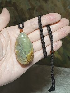 Hetian Pebble Nephrite with raw "Jade Skin" light green hand carved Ginseng Ruyi and Coin pendant (with certificate) 和田玉籽玉天然褐黄皮淡青绿手工雕刻人生(参)如意吊坠(带证书)
