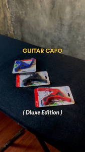 Capo Kapo Penjepit Senar Gitar Bass Ukulele Bahan Plastik Merek DLUXE