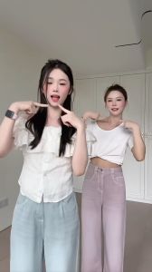 เสื้อครอปสีครีม แขนกุด เปิดไหล่ แต่งระบาย2ชั้น รอบอกสม็อคยางยืด กระดุมหน้า ผ้า Tencel ใส่สบาย ชายผ้าโค้ง พรางหุ่น เสื้อเบลาส์ #6828