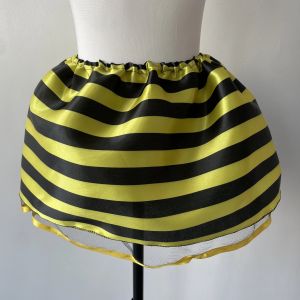 A Children's Bee Dress Skirt with Yellow and Black Floral Fabric on the Outside and a Layer of Mesh on the Inside
