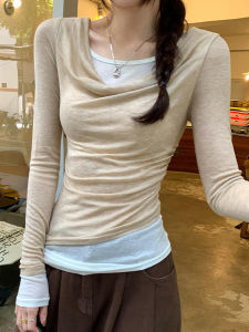 เสื้อยืดคอกลมแขนยาวทรงเข้ารูปสำหรับผู้หญิง ฤดูใบไม้ผลิ 2025 เสื้อผ้าทำงานสไตล์เกาหลี ดีไซน์เก๋ไก๋ แขนยาว คอกลม แขนยาว แขนยาว