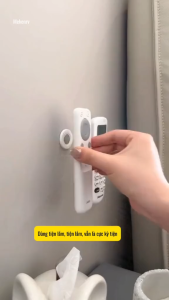 Dụng cụ treo remote điều khiển dán tường nam châm gọn gàng.