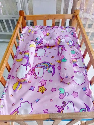 Varnish Adjustable Crib with Uratex Foam and Pillow Set (22x36 inches) - Wooden crib with adjustable height featuring colorful dinosaur-themed bedding and pillows.