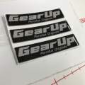 GEAR UP Logo Emblem Original Design Perodua Bezza Acia Myvi Ativa Alza Aruz Kancil Kelisa Kenali Kembara   Size: 7cm x 1.6cm  Ukuran: 70 x 16mm  Sticker 3M Original Design Perodua Emblem. 