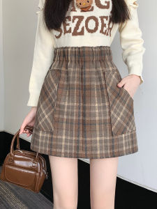 กระโปรงสั้นทรงเอผ้าขนสัตว์ลายสก็อตสีดำและสีน้ำตาลหนาสำหรับผู้หญิงในฤดูใบไม้ร่วงและฤดูหนาวปี 2025 กระโปรงสั้นทรงเอป้องกันแสงสะท้อน
