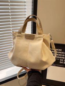 กระเป๋าผ้าแคนวาสความจุขนาดใหญ่ ผู้หญิง 2024 แฟชั่นใหม่ ลำลอง กระเป๋าสะพายไหล่ยอดนิยมสําหรับการเดินทางและเรียนในปีนี้