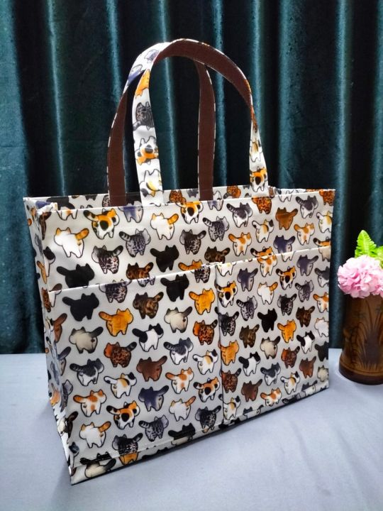 #กระเป๋าผ้าเคลือบกันน้ำ 👜จ้นโบ้เดินทาง ( ลายพร้อมส่ง) 📏ขนาดกว้าง 16 ...