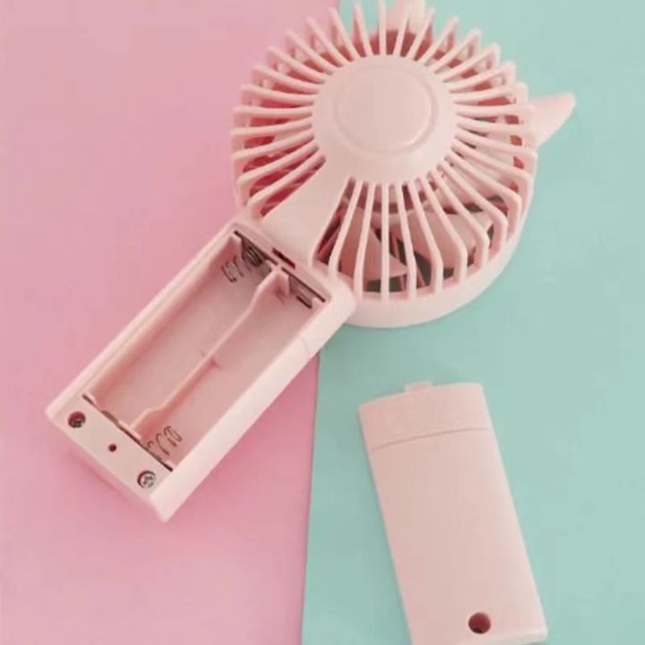 Portable%20Handheld%20AA%20Battery%20Mini%20Desktop%20Air%20Cooler%20Fans%20with%20Cat%20Ear%20Design%20in%20Pink%20and%20Green%20for%20Outdoor%20Travel%20Use%20-%20Image%205