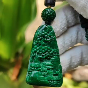 Dark Green Natural Type A Jadeite carved with scenery pendant with NGI Gemstone report weight 19.21 grams  43.10 * 25.36 * 7.50 mm  Semi Translucent to opaque fine grain crystal aggregate - Good for daily wear pendant (pendant152)